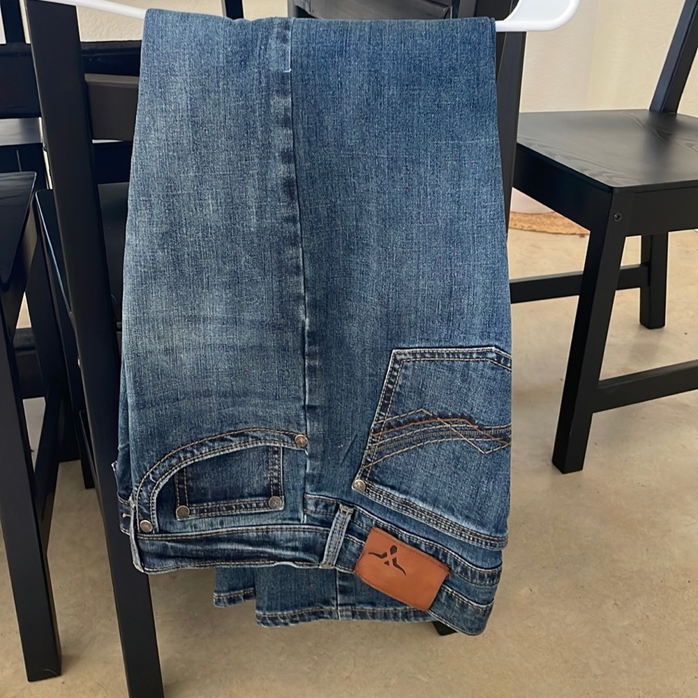 Starched wrangler blue jeans.